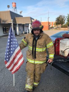 Decatur fireman takes a knee for the fallen